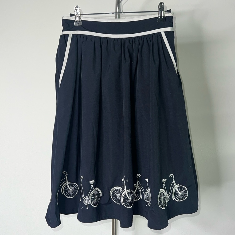🔹 Comme Toi… Skirt with Embroidered Bicycle Hem